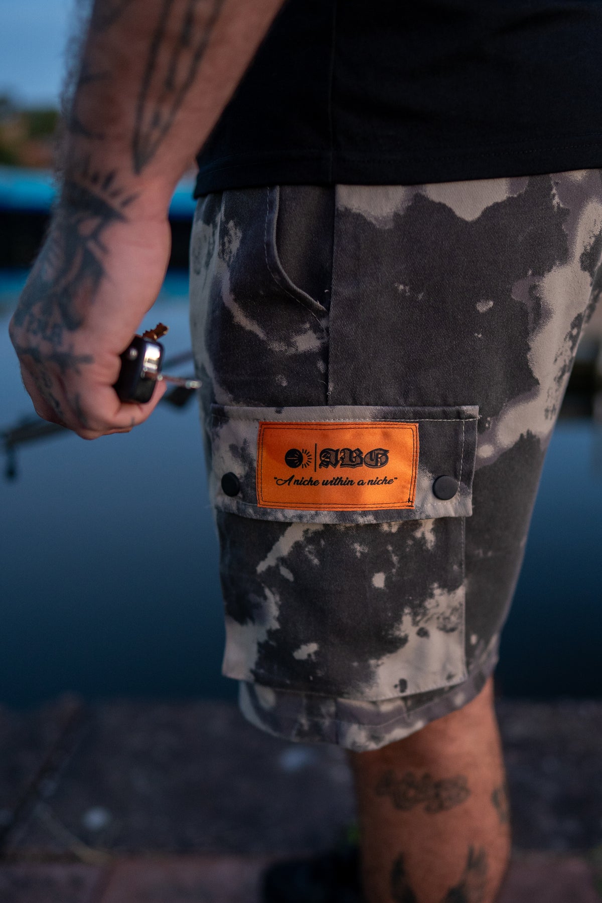 “NICHE” cargo shorts.
